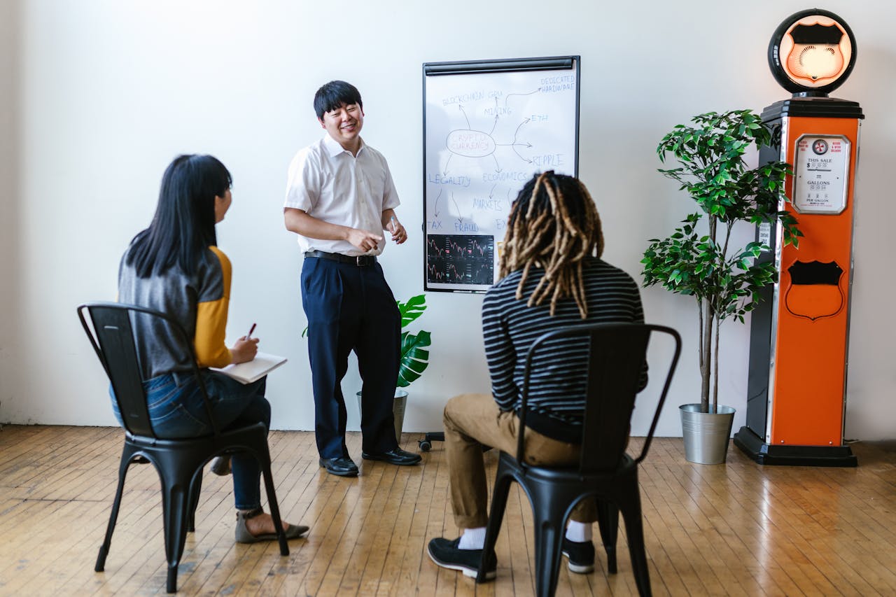 Diverse group engaged in a collaborative brainstorming session in an office setting.